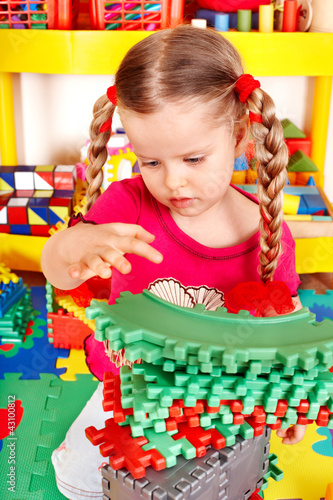 Photo: Child playing with building block . Child playing with building block .