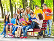Group student with book outdoor.