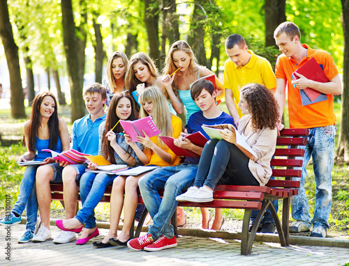 Photo: Group student with book outdoor. Group student with book outdoor.