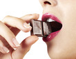 woman with pink lips biting chocolate bar detail