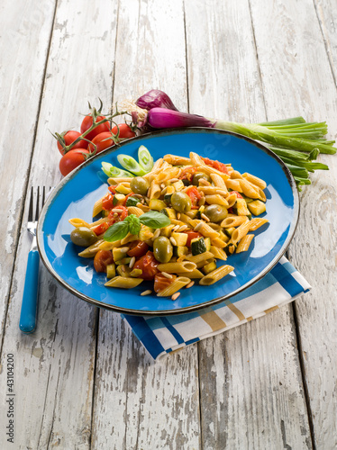 Foto: cold pasta salad with pachino olives zucchins and pine kernel cold pasta salad with pachino olives zucchins and pine kernel