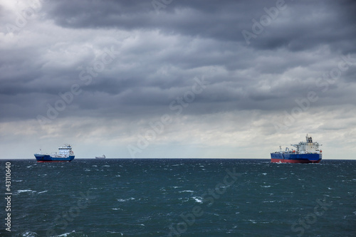 Photo: Two ships at sea and the upcoming storm. Two ships at sea and the upcoming storm.