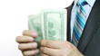 Businessman counts money in hands.