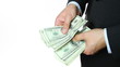 Businessman counts money in hands.