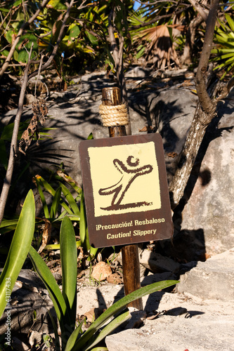 Photo: Bilingual Spanish English Sign Caution Slippery Bilingual Spanish English Sign Caution Slippery