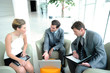 Business people meeting in trade fair building hall