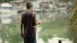 Video: Active senior man fishing on river for hobby Active senior man fishing on river for hobby