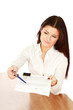 Businesswoman giving you the pen and the contract