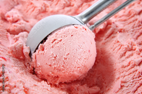 Photo: Strawberry ice cream scooped out of container Strawberry ice cream scooped out of container