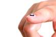 Computer microchip on girls fingernail