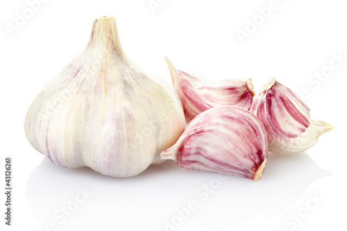 Photo: Fresh garlic and cloves on white, clipping path included Fresh garlic and cloves on white, clipping path included