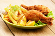 Fried drumsticks with french fries