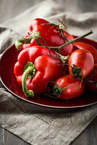 Photo: Peppers and tomatoes on a plate Peppers and tomatoes on a plate