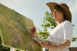 Woman painting outdoors