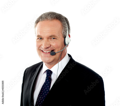 Photo: Closeup of senior customer service operator Closeup of senior customer service operator