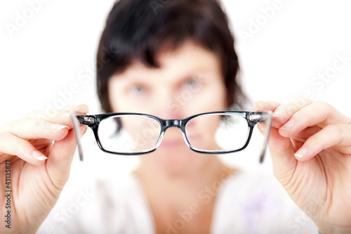 Photo: Opticians in fitting eyeglasses Opticians in fitting eyeglasses