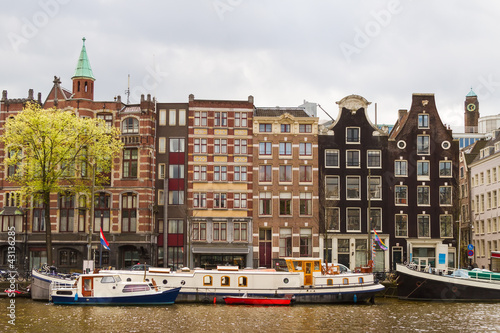 Photo: Street with traditional buildings in Amsterdam Street with traditional buildings in Amsterdam
