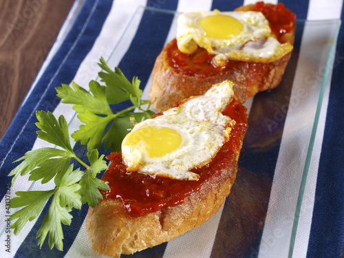 Photo: Soft spicy sausage and quail eggs “Montadito”. Soft spicy sausage and quail eggs “Montadito”.