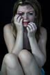 Scared and beaten woman in pain and crying