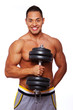 Portrait of smiling man posing in studio with dumbbells