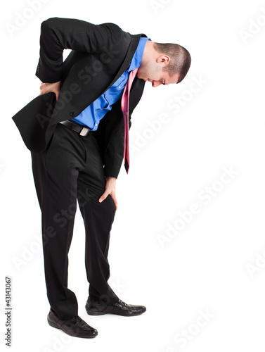 Photo: Man suffering for backache. Isolated on white Man suffering for backache. Isolated on white