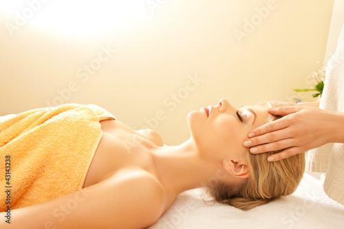 Photo: beautiful woman in massage salon beautiful woman in massage salon