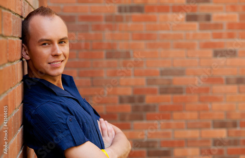 Photo: portrait of a young smiling nice man portrait of a young smiling nice man