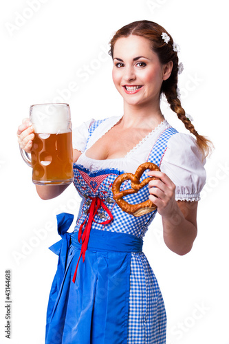 Photo: junge brünette Frau im Dirndl mit Masskrug und Brezn junge brünette Frau im Dirndl mit Masskrug und Brezn