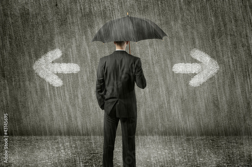Photo: businessman has to make a decision businessman has to make a decision