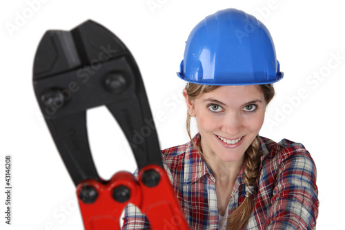 Photo: female plumber holding giant spanner female plumber holding giant spanner