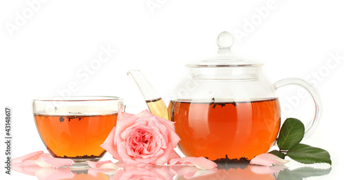 Photo: teapot and cup of tea with rose isolated on white teapot and cup of tea with rose isolated on white