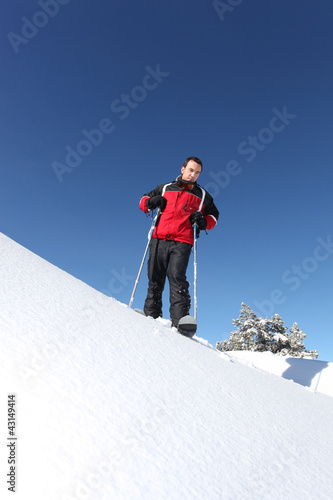 Photo: Male skier on a mountain Male skier on a mountain