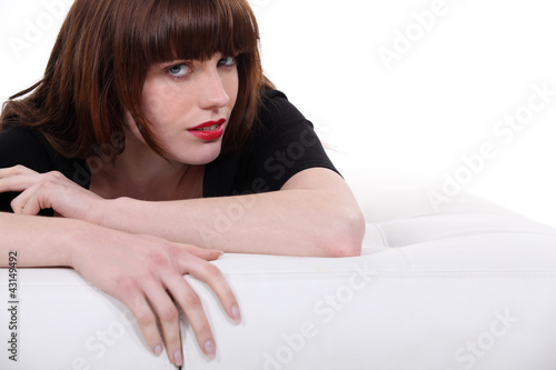 Photo: Woman hugging a footrest Woman hugging a footrest