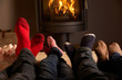 Photo: Close Up Of Familys Feet Relaxing By Cosy Log Fire With Marshmal Close Up Of Familys Feet Relaxing By Cosy Log Fire With Marshmal