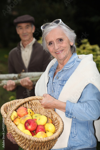 Photo: Couple with basket of apples Couple with basket of apples