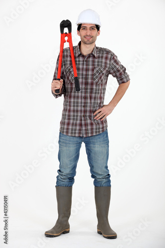 Foto: Construction worker with boltcutters Construction worker with boltcutters