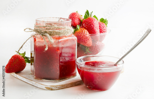 Photo: strawberries marmalade on a wooden table strawberries marmalade on a wooden table