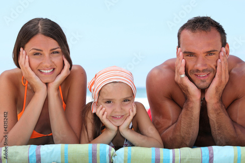 Photo: Portrait of a lovely family at the beach Portrait of a lovely family at the beach