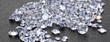 Loose diamonds on black surface