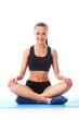 Smiling fitness girl sitting in standart yoga pose