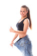 Photo: Woman wearing old jeans after weight loss Woman wearing old jeans after weight loss