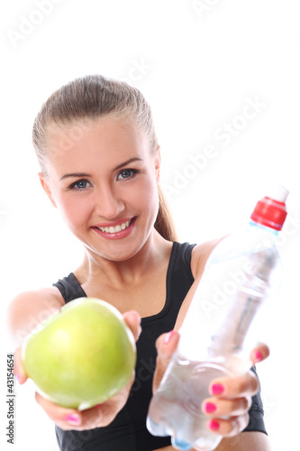 Photo: Woman with apple and bottle of fresh water Woman with apple and bottle of fresh water