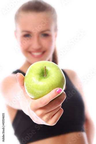 Photo: Young and happy woman with green apple Young and happy woman with green apple