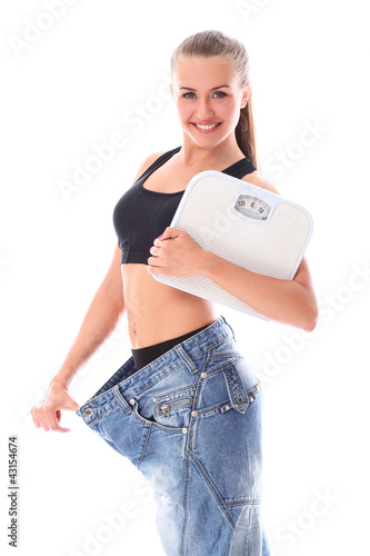 Photo: Woman wearing old jeans after weight loss Woman wearing old jeans after weight loss