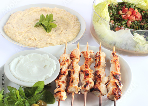 Photo: Shish taouk - Chicken shish kebab on white platter Shish taouk - Chicken shish kebab on white platter