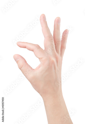 Photo: Fingers hold small object Fingers hold small object