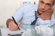 Bored office worker writing