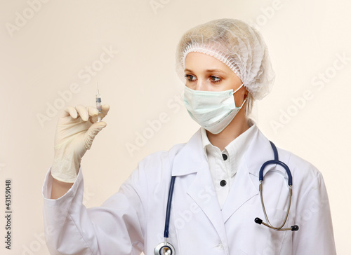 Photo: Medical doctor with syringe Medical doctor with syringe