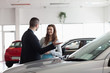 Dealer speaking to a woman