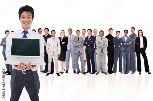 Photo: Businessman holding a laptop Businessman holding a laptop